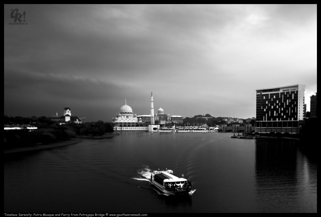 Timeless Serenity: Putra Mosque and Ferry from Putrajaya Bridge